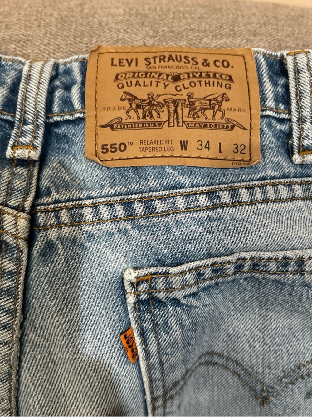 Levi's light blue denim jeans with gold stitching